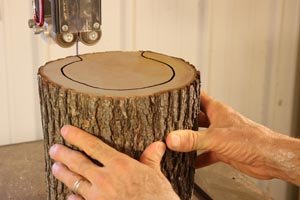 Use a bandsaw to remove center of birdfeeder.