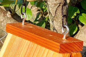 Hang A-Frame bird house using eye screws and chain.