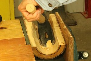 Remove inside of log using adze or carving tools.