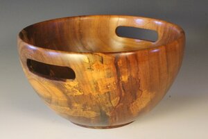 Wooden bowl with cut out handles