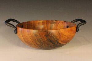 Wooden bowl with metal handle