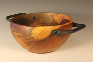Wooden bowl with metal handles