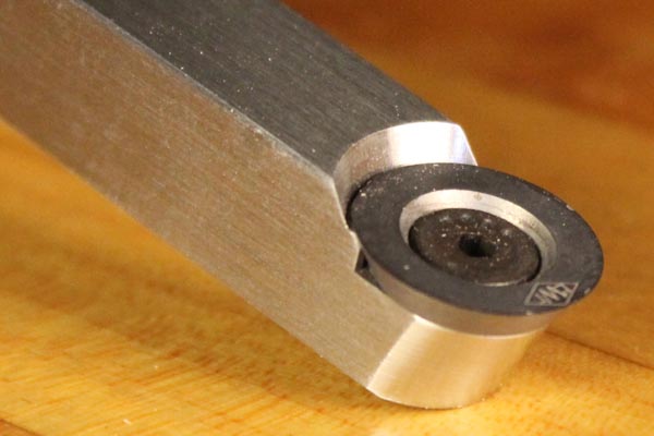 A turning tool with a round carbide cutter.