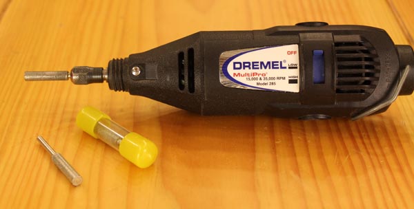 A rotary tool with a diamond bit used for sharpening hook and ring tools.
