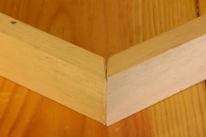 Test for gap in miter joint before assembly.