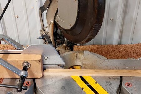 DIY planter box cutting side pieces on miter saw.