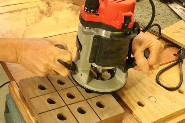 Use a router to round edges of tic-tac-toe game board.