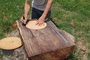 Mark outline of dough bowl on wooden slab.