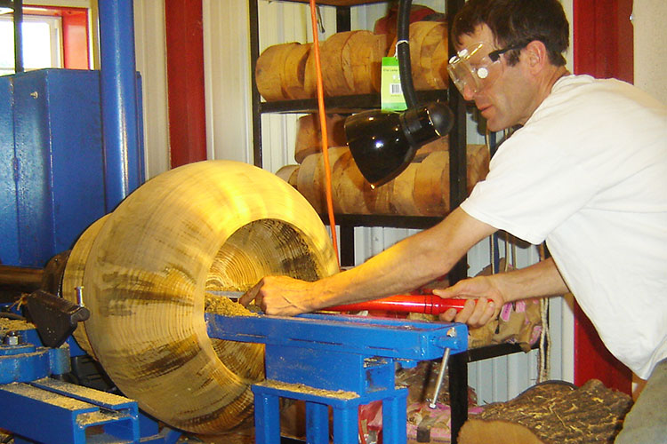 Turning the inside of a large pine bowl.