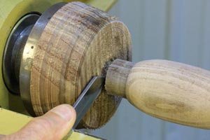 Use a parting tool to remove and let the scoop dry (if using wet wood).
