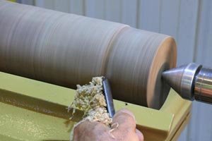 Turn the blank to a round cylinder using a bowl gouge - woodturning.