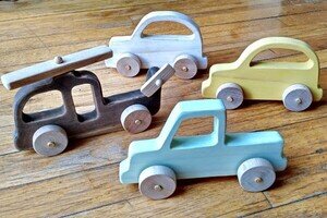Wooden toy vehicles.